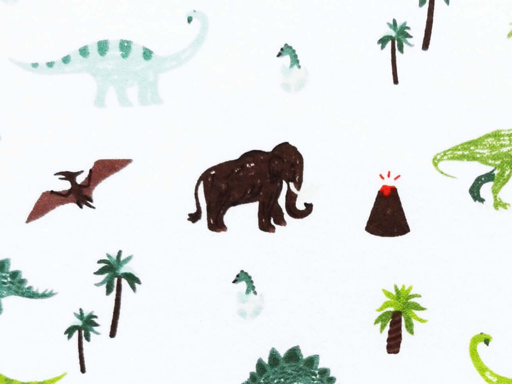 Rice heating pad made with soft cotton flannel with dinosaurs on printed on it