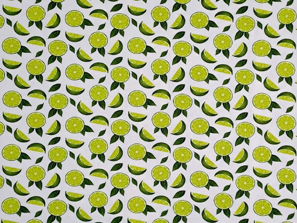 Rice heating pad made with soft cotton flannel with bright limes printed all over it - some cream background showing