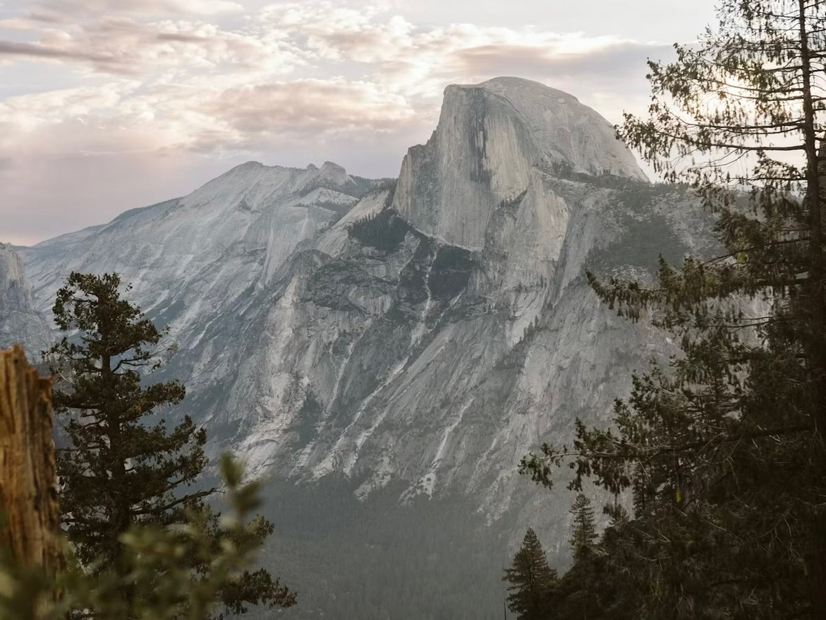 National Park Ritual Oils - Scenic view of Half Dome in Yosemite National Park showcasing majestic wilderness.