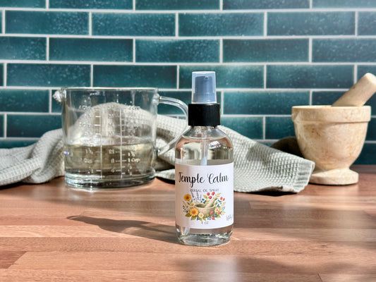 Bottle of 'Temple Calm' on a wooden surface with a kitchen background