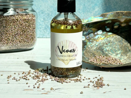 Venus Goddess Ritual Oil bottle with decorative elements on a light surface