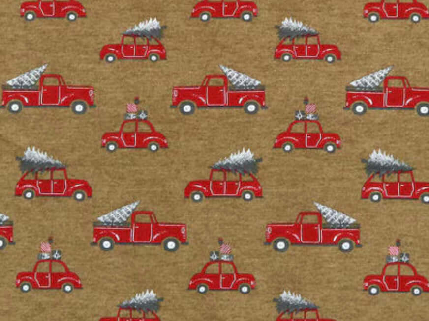 Rice heating pad made with soft cotton flannel with red trucks and Christmas trees printed all over it - kraft brown background