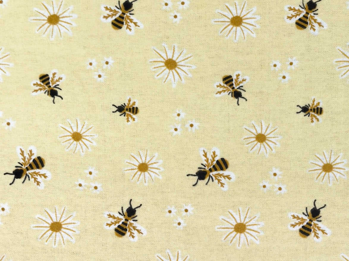 Herbal Comfort Heat Pack - Spring Patterns featuring bees and daisies on a soft yellow background.