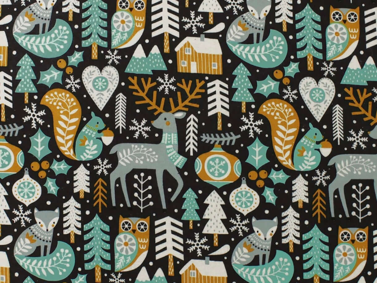 Rice heating pad made with soft cotton flannel with woodland animals printed all over it - black background