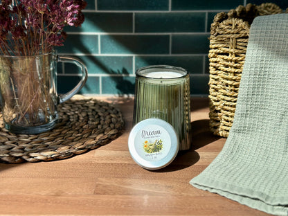 Dream Healing Sleep Balm beside a calming candle and dried flowers on a wooden table, perfect for bedtime rituals.