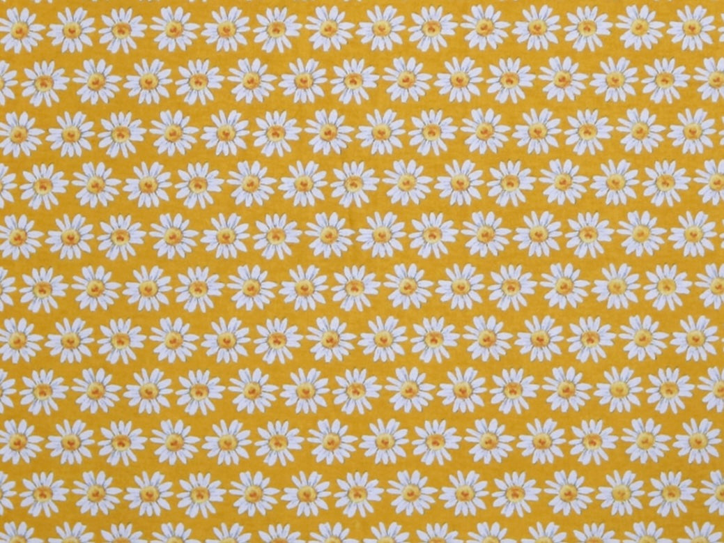 Herbal Comfort Heat Pack - Spring Patterns fabric featuring a cheerful yellow background with white daisy flowers.