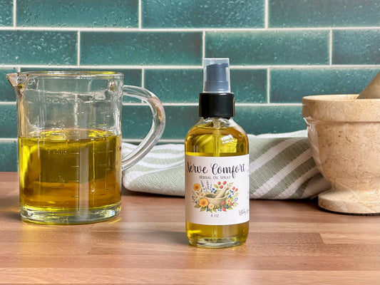 Bottle of 'Nerve Comfort' oil next to a glass container on a wooden surface with a tiled wall background.