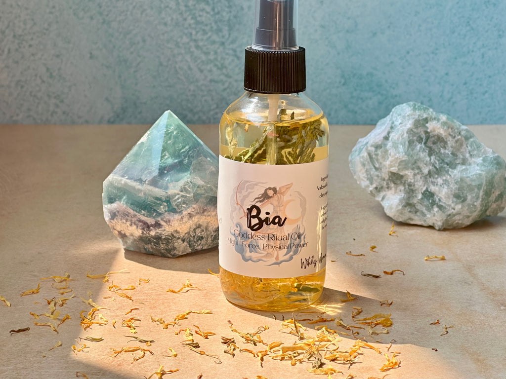 Bottle of Bia oil with crystals and dried flowers on a neutral background