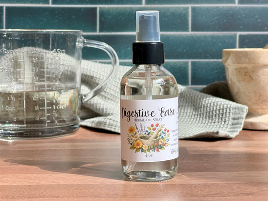 Bottle of 'Digestive Ease' herbal oil spray on a wooden surface with a measuring cup and towel in the background.
