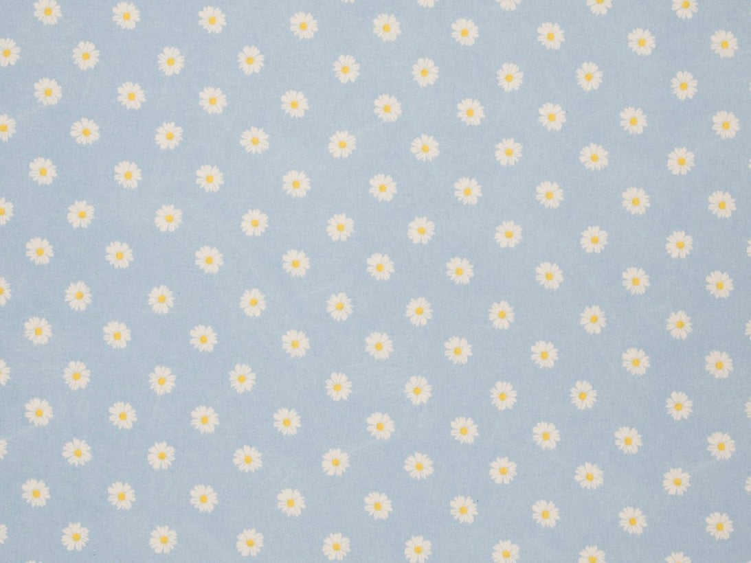 Patterned fabric with white daisies on a blue background, featured on the Herbal Comfort Heat Pack - Spring Patterns.
