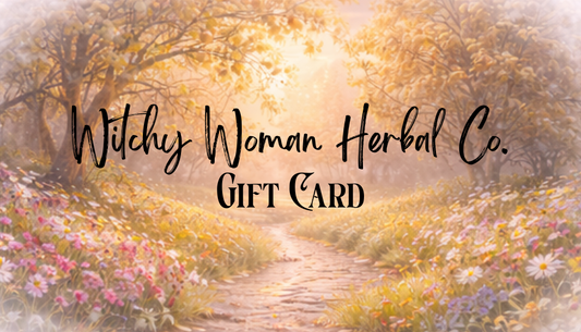 Gift card design with a forest path and flowers, featuring 'Witchy Woman Herbal Co.'